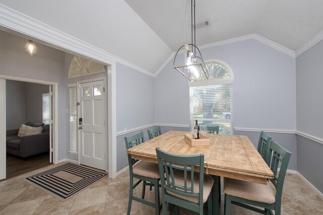 dining space featuring vaulted ceiling, ornamental molding, visible vents, and baseboards