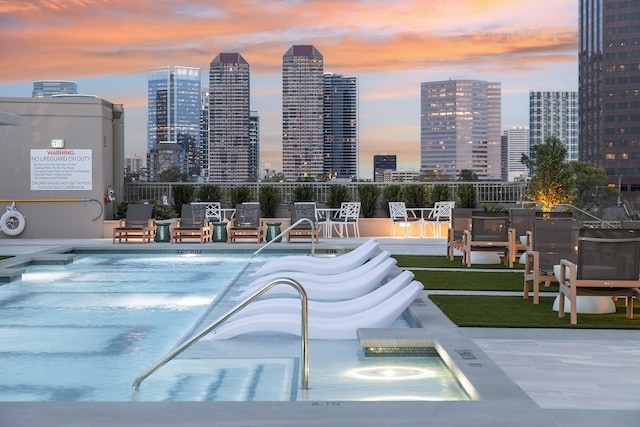 view of swimming pool featuring a view of city