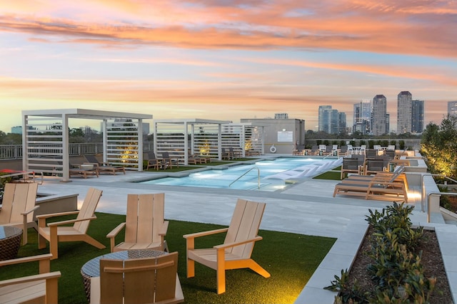 pool featuring a patio area and a view of city