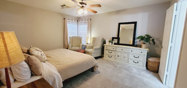 bedroom featuring a ceiling fan and light carpet