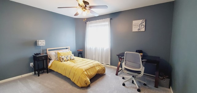 bedroom featuring carpet floors, baseboards, and a ceiling fan