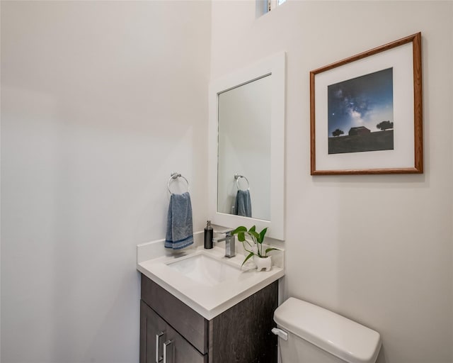 bathroom with toilet and vanity