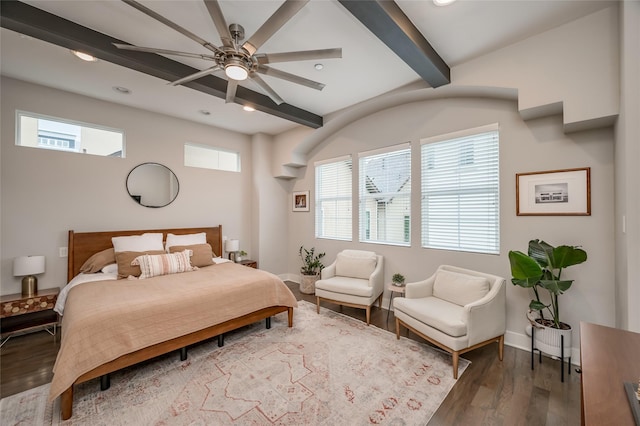 bedroom featuring beamed ceiling, recessed lighting, wood finished floors, and baseboards