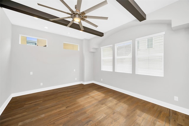 empty room with lofted ceiling with beams, ceiling fan, wood finished floors, and baseboards