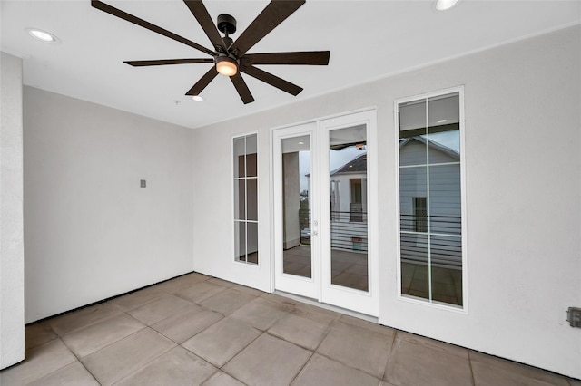 unfurnished room featuring tile patterned floors, a ceiling fan, and recessed lighting