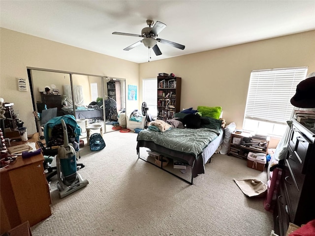 carpeted bedroom featuring ceiling fan