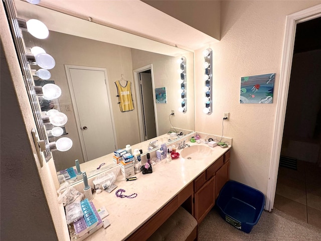 bathroom with vanity and tile patterned floors