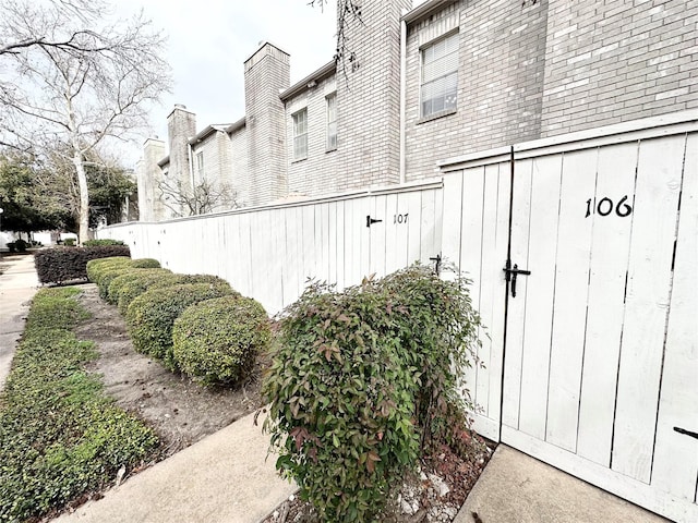 view of side of home featuring brick siding