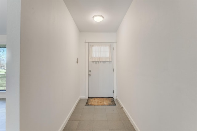 doorway with baseboards