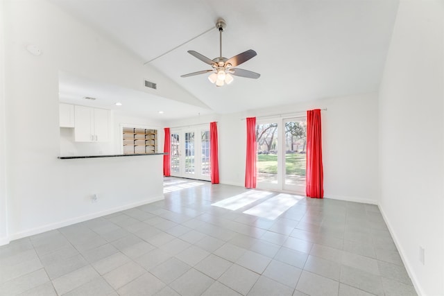 unfurnished room with a ceiling fan, light tile patterned flooring, visible vents, and baseboards