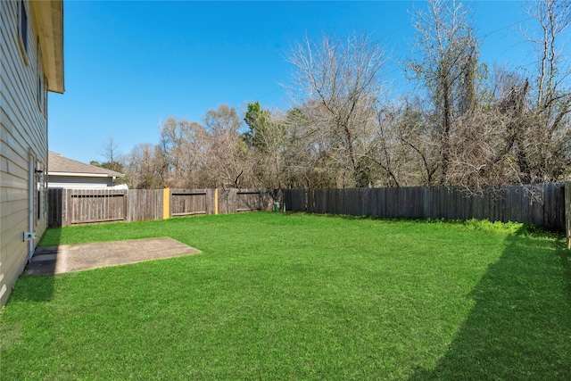 view of yard featuring a patio area and a fenced backyard