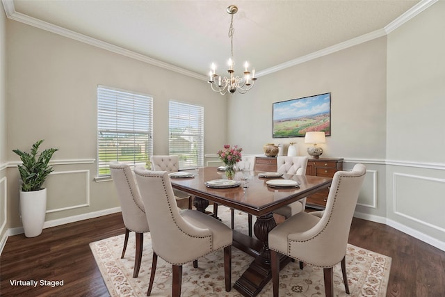 dining area with a chandelier, wainscoting, dark wood-type flooring, and ornamental molding