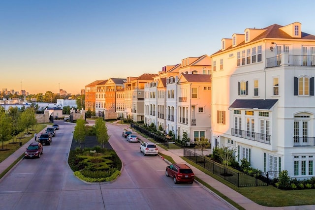 view of property's community featuring fence and a residential view