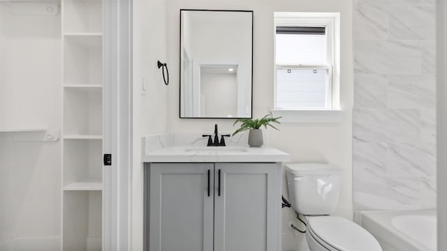 full bath featuring toilet and vanity