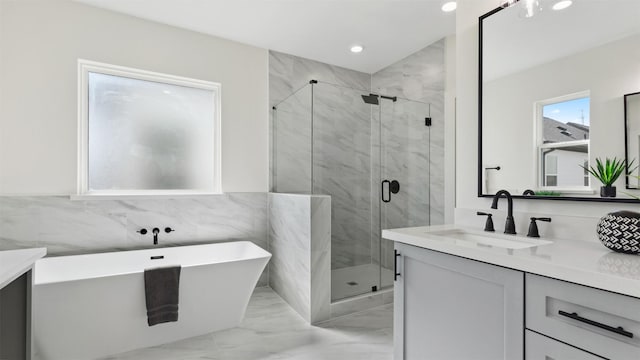 bathroom with vanity, a shower stall, recessed lighting, and marble finish floor