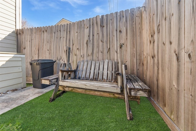 deck with a lawn and fence