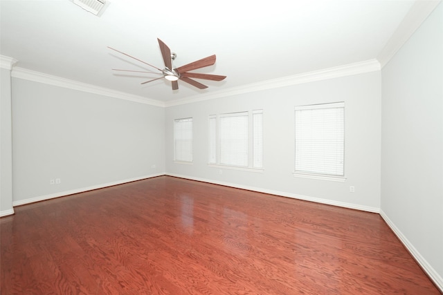 unfurnished room with dark wood-style floors, ceiling fan, visible vents, and ornamental molding