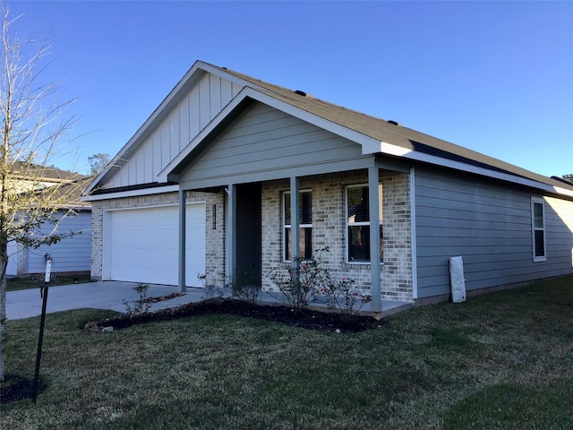 view of front of property featuring a garage, a front lawn, board and batten siding, and brick siding