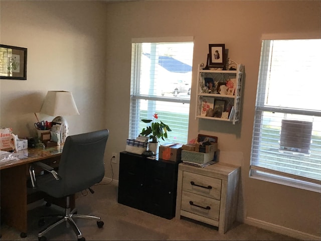 carpeted office space with baseboards