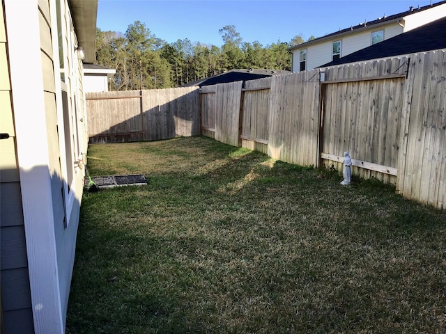 view of yard featuring a fenced backyard