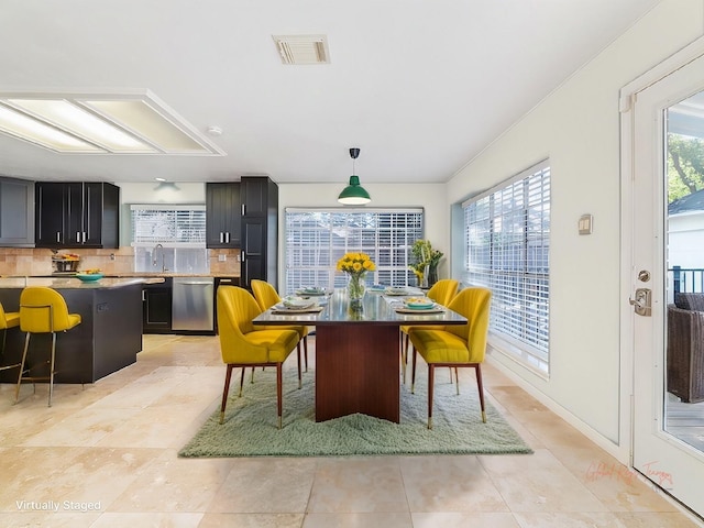 dining room featuring visible vents and light tile patterned floors