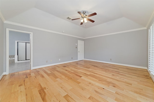 empty room with baseboards, ornamental molding, visible vents, and light wood-style floors