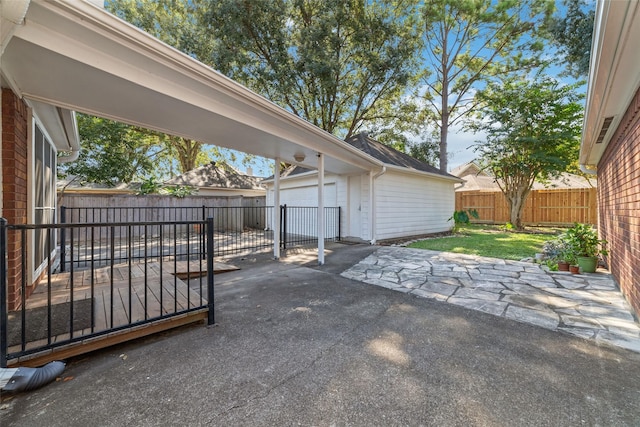 view of patio / terrace with an outbuilding and a fenced backyard