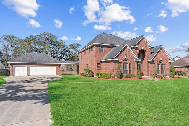 traditional-style home with a garage, brick siding, and a front lawn