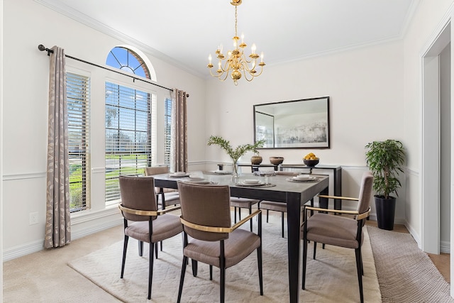 dining area with crown molding, a notable chandelier, baseboards, and light carpet