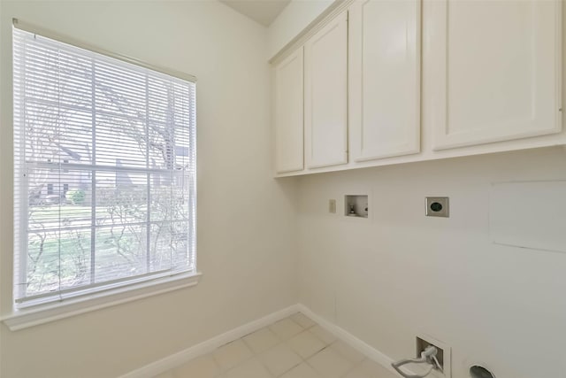 laundry area with washer hookup, hookup for an electric dryer, cabinet space, and baseboards