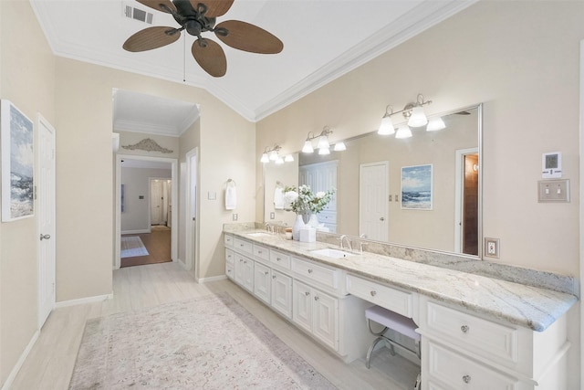 full bathroom featuring double vanity, visible vents, a sink, and ornamental molding