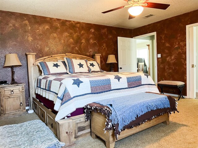 20315 Post Oak Loop, Thornton, TX 76687 - carpeted bedroom featuring a textured ceiling, visible vents, a ceiling fan, and wallpapered walls