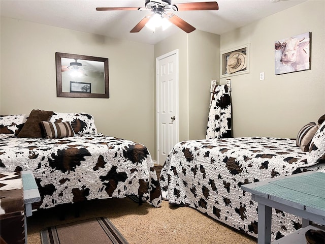 bedroom featuring ceiling fan and carpet floors