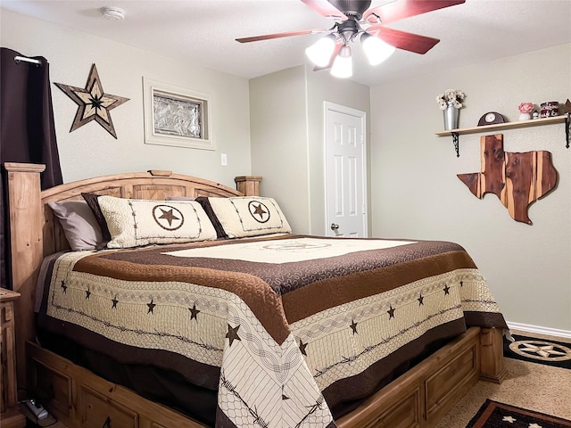 carpeted bedroom with baseboards and a ceiling fan