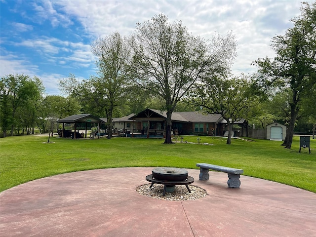 20315 Post Oak Loop, Thornton, TX 76687 - view of patio featuring an outdoor structure, a gazebo, and an outdoor fire pit