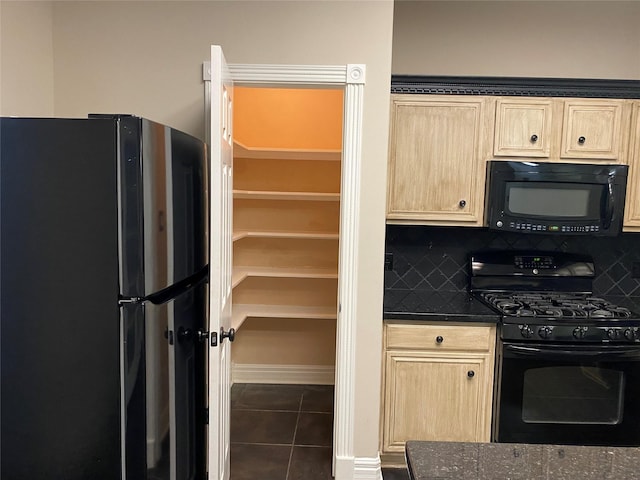 kitchen featuring tasteful backsplash, black appliances, and light brown cabinetry