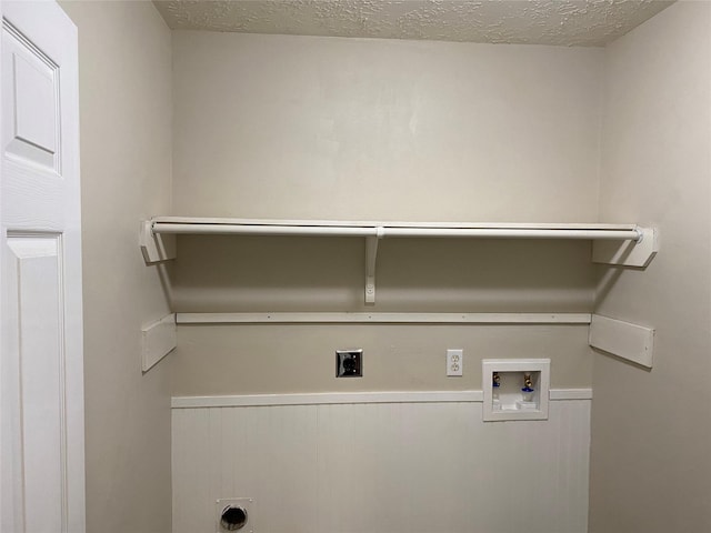 laundry area with washer hookup, laundry area, hookup for an electric dryer, and a textured ceiling