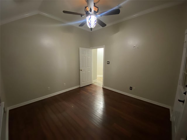 unfurnished bedroom featuring a ceiling fan, crown molding, wood finished floors, and baseboards