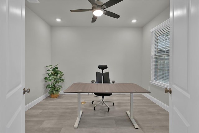 office with light wood-type flooring, baseboards, a ceiling fan, and recessed lighting