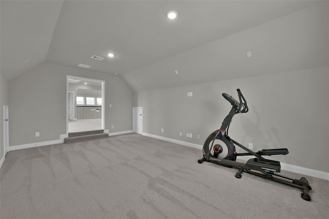 exercise area with recessed lighting, visible vents, vaulted ceiling, and baseboards