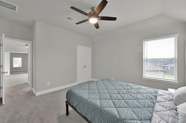 bedroom with baseboards, visible vents, vaulted ceiling, and carpet flooring