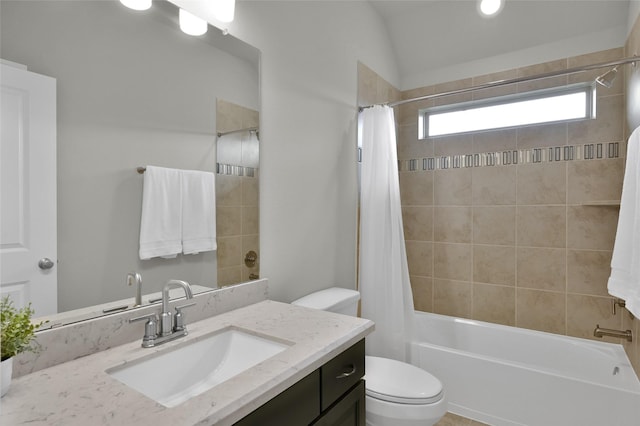 bathroom featuring shower / tub combo, vanity, and toilet