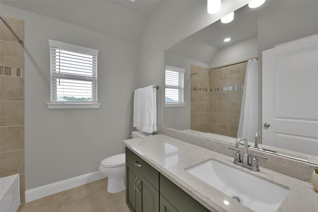 bathroom with baseboards, vanity, toilet, and tile patterned floors