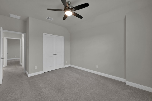 unfurnished bedroom featuring carpet, visible vents, baseboards, and a closet