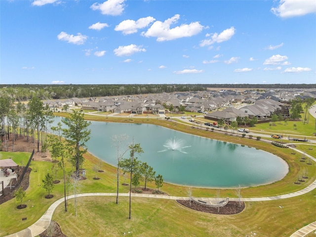 drone / aerial view with a water view and a residential view