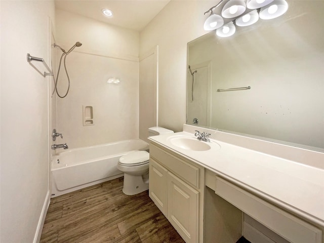 bathroom with tub / shower combination, vanity, toilet, and wood finished floors