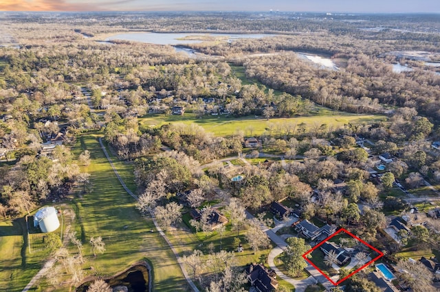 546 River Plantation Dr, Conroe, TX 77302 - aerial overview of property's location with property parcel outlined and a nearby body of water