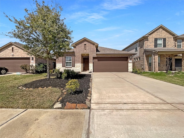 view of front of house featuring a garage, brick siding, stone siding, driveway, and roof with shingles