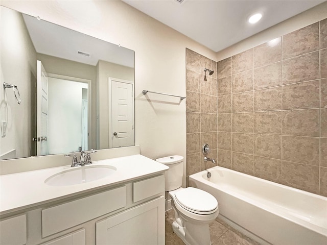 full bath with toilet, vanity, visible vents, shower / bathing tub combination, and tile patterned floors