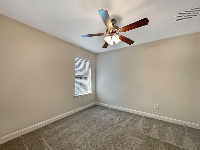 unfurnished room featuring a ceiling fan, dark colored carpet, visible vents, and baseboards